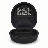 kalmkind ear defenders carry case, open and empty, showing the branded interior and mesh pocket